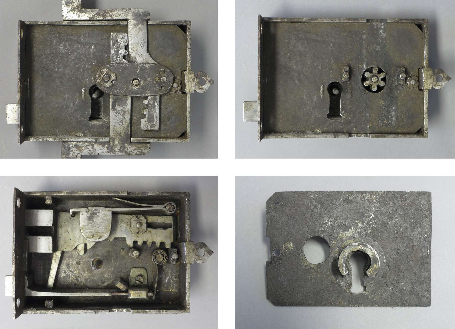 four views of a disassembled lock from the cabinet, revealing the gears and spring catch that make up the locking mechanism