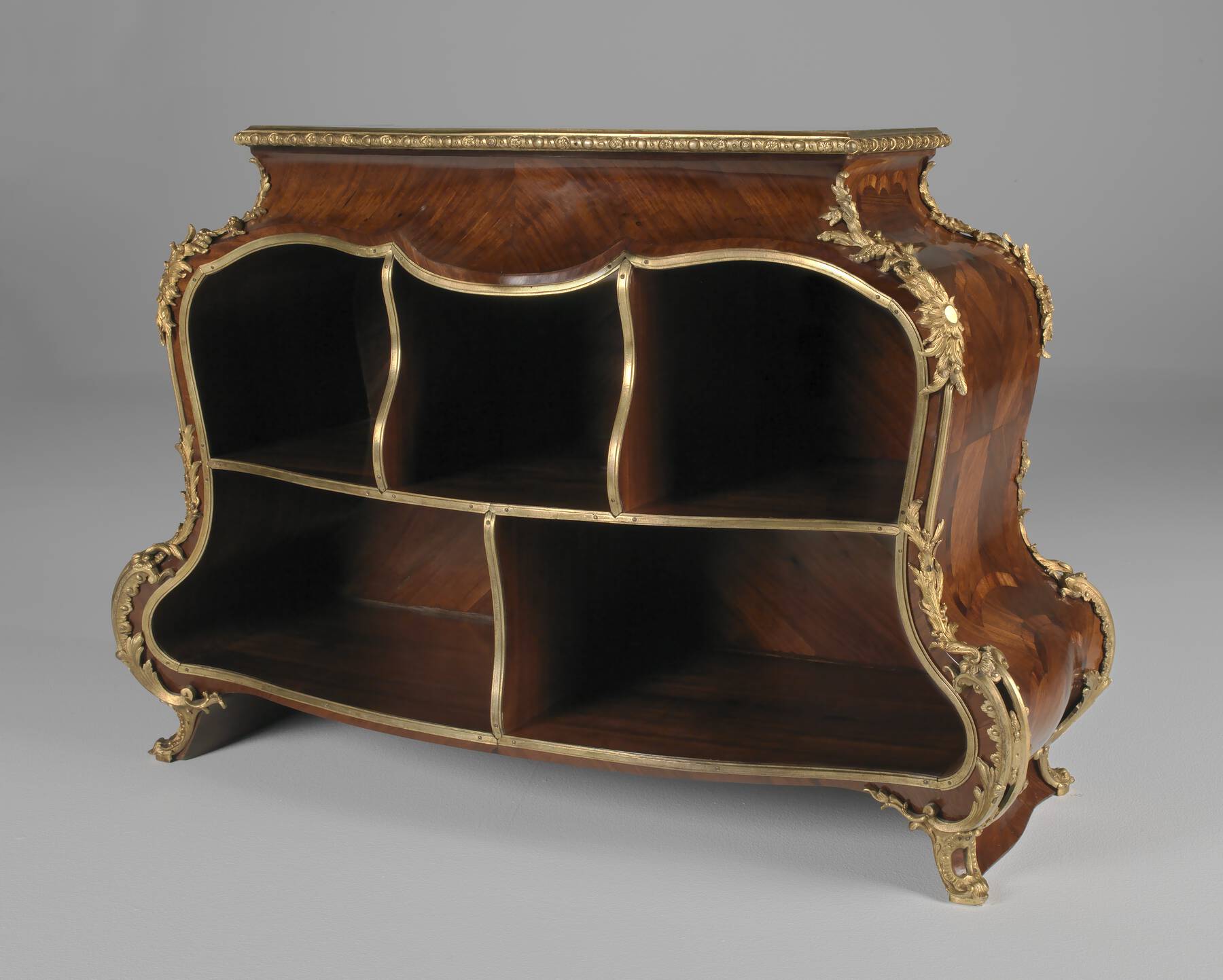 three-quarter view of a dark wood cartonnier with veneer, floral gilt bronze mounts, and five filing compartments