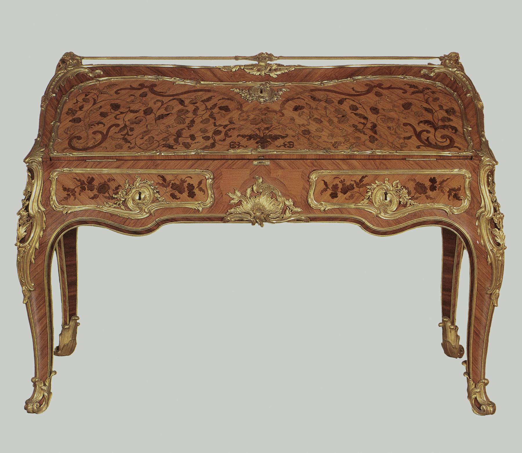 an additional desk, decorated with floral marquetry, veneer, and gilt bronze mounts in a similar style to the Getty desk